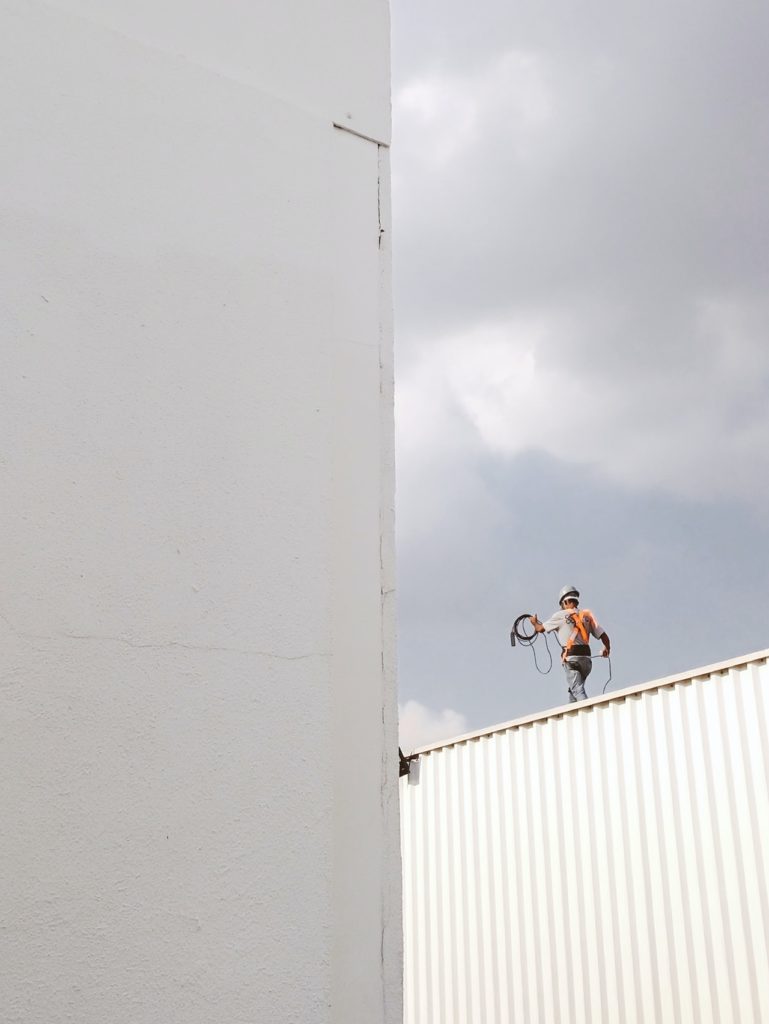 Man Walking on Roof